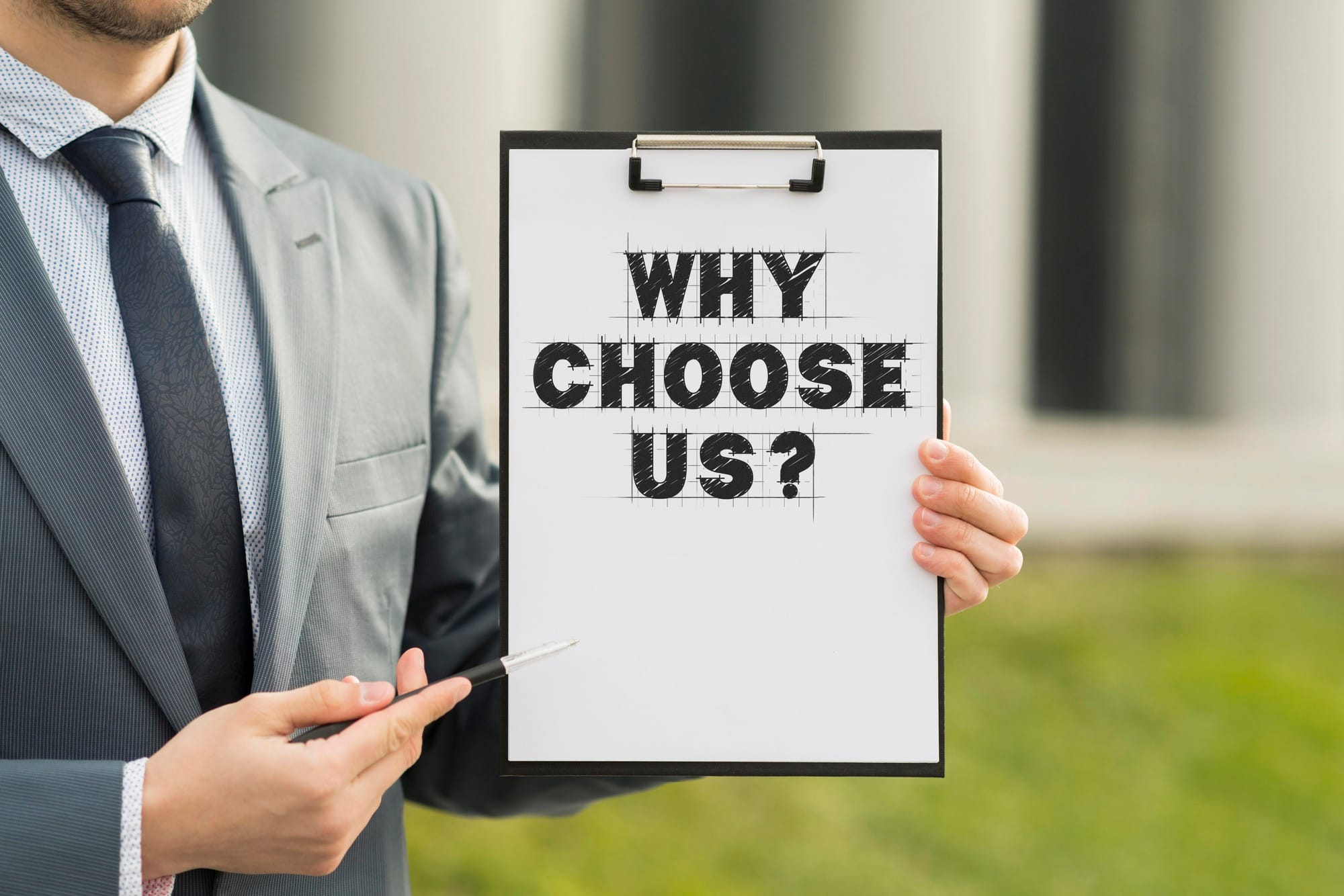 Business Man Holding Clipboard With Why Choose Us Question